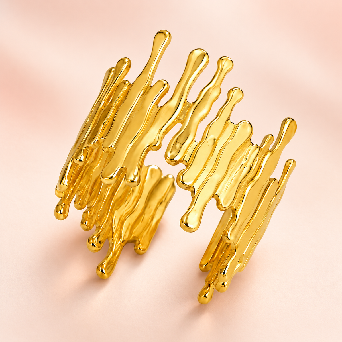 Gold-tone open ring with irregular drip-shaped edges