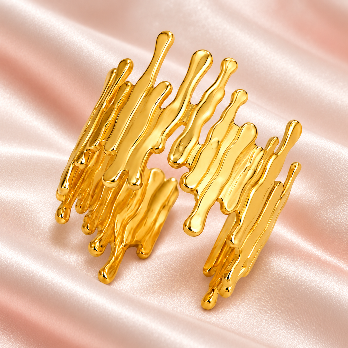 Gold-tone open ring with irregular drip-shaped edges