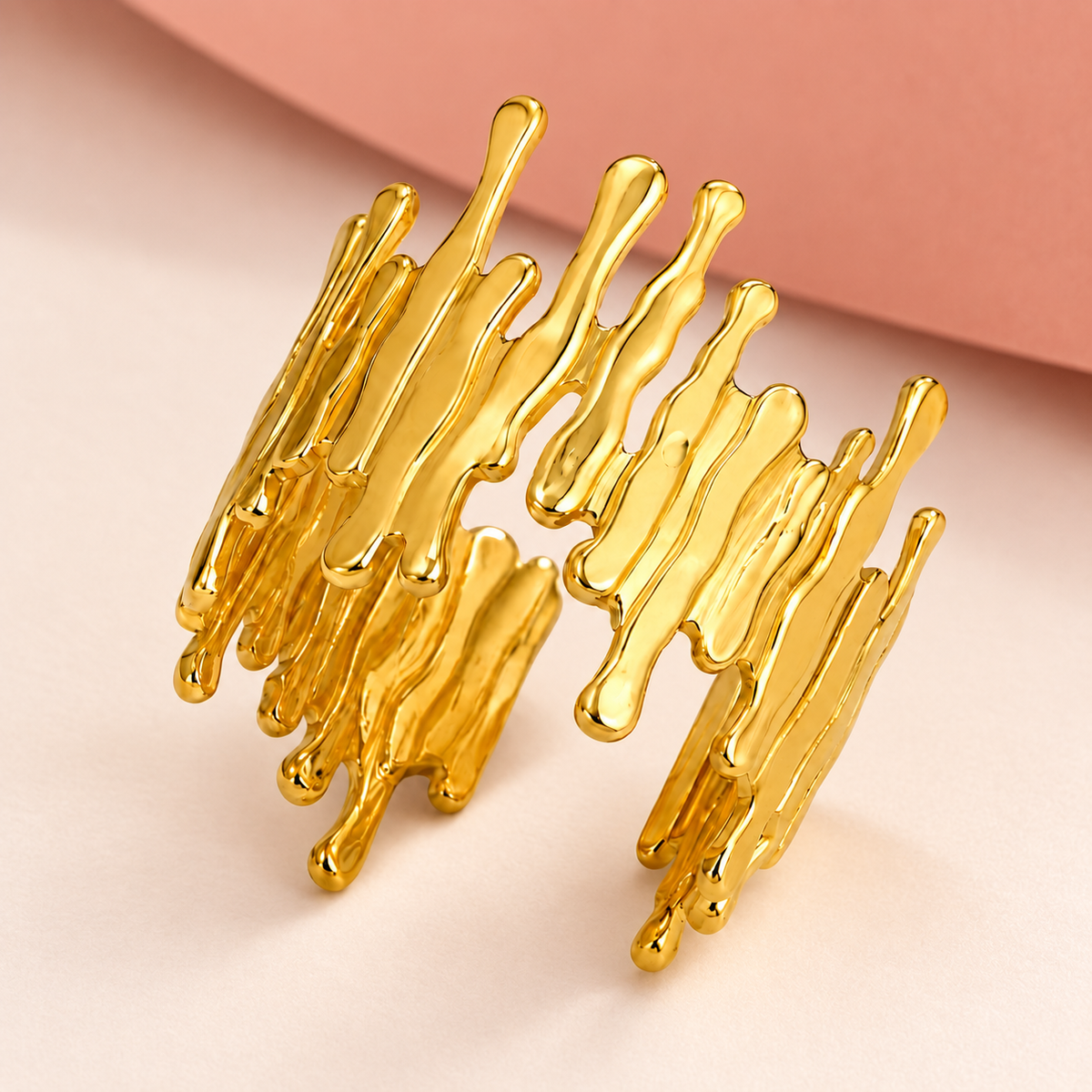 Gold-tone open ring with irregular drip-shaped edges