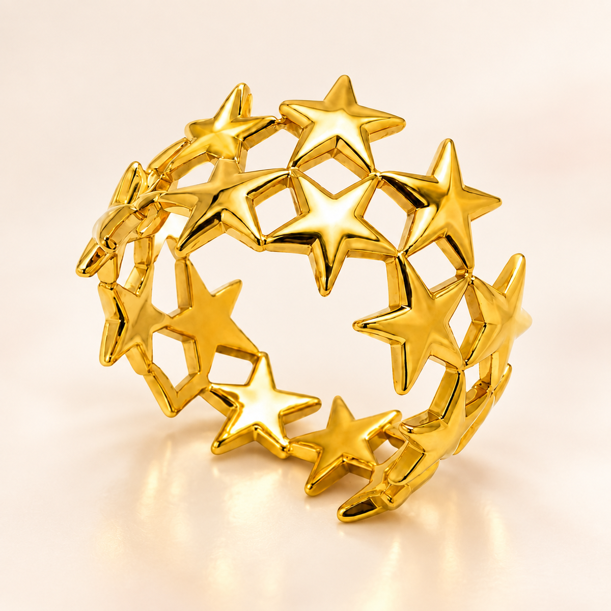 Gold-tone star lattice ring, product view.