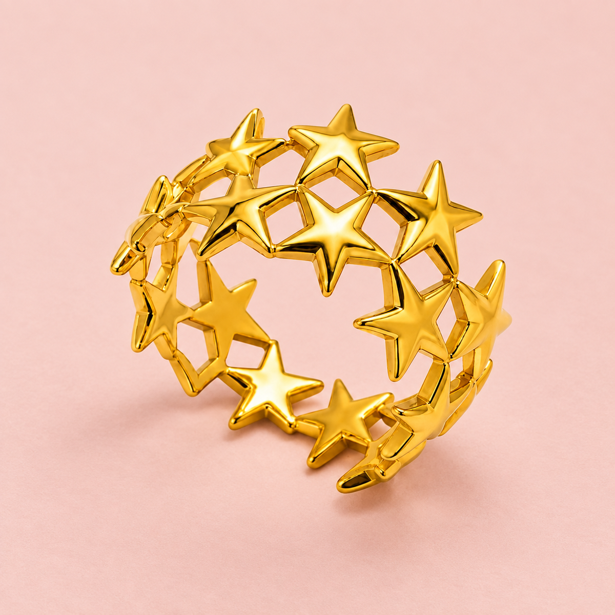 Gold-tone star lattice ring, detail view.