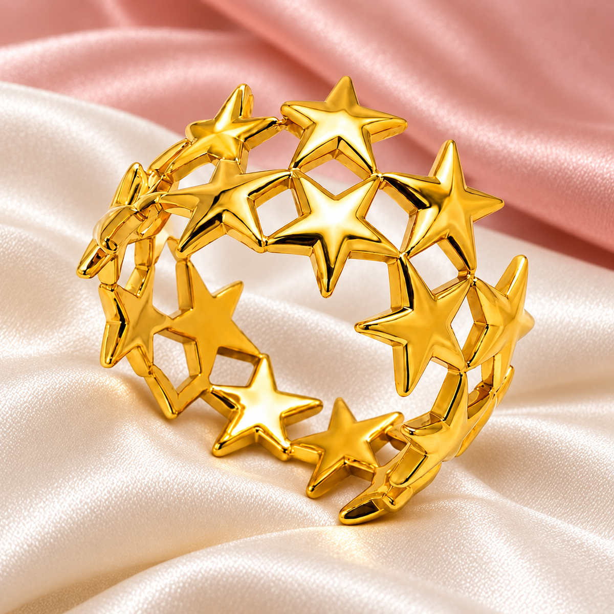 Gold-tone star lattice ring, still-life view on fabric.