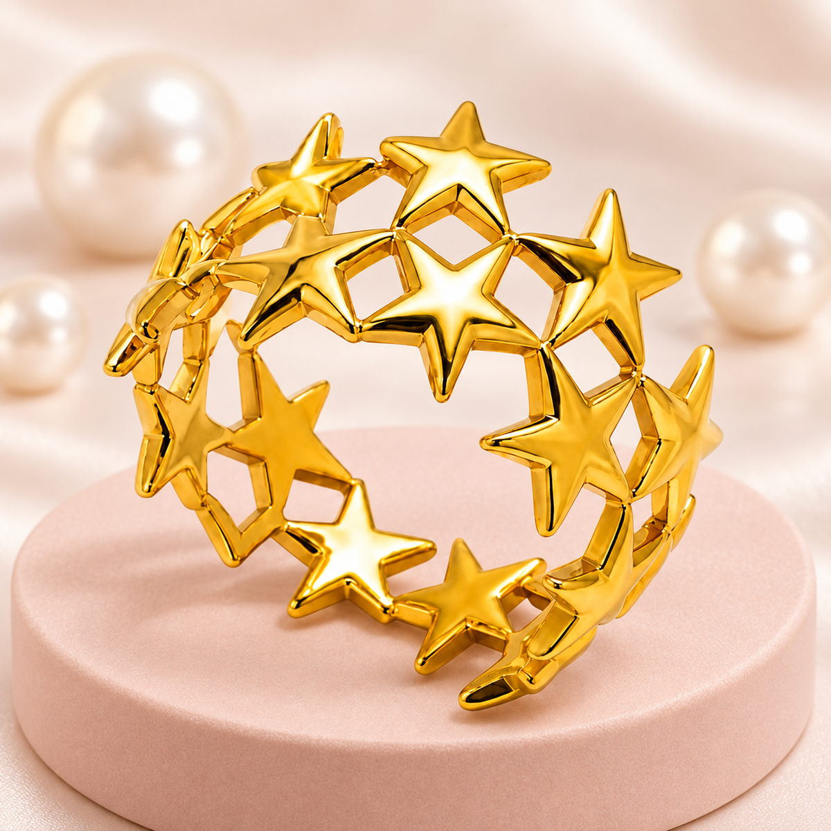 Gold-tone star lattice ring, styled product view.