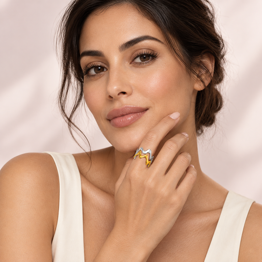 Two-tone wavy ring, shown on a hand.