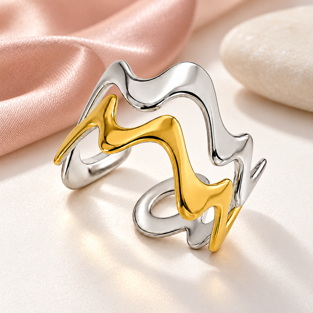 Two-tone wavy ring, styled product view.