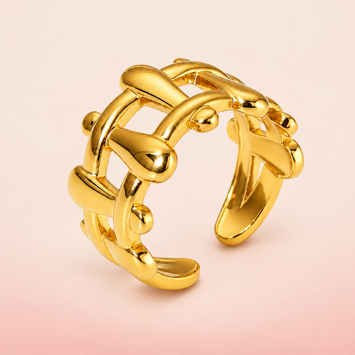 Gold-tone sculptural lattice ring, product view.