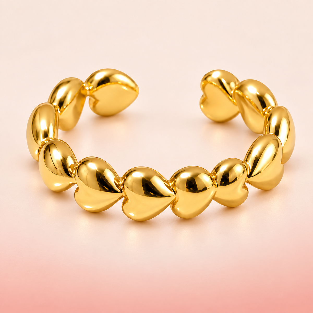 Gold-tone heart chain ring, product view.