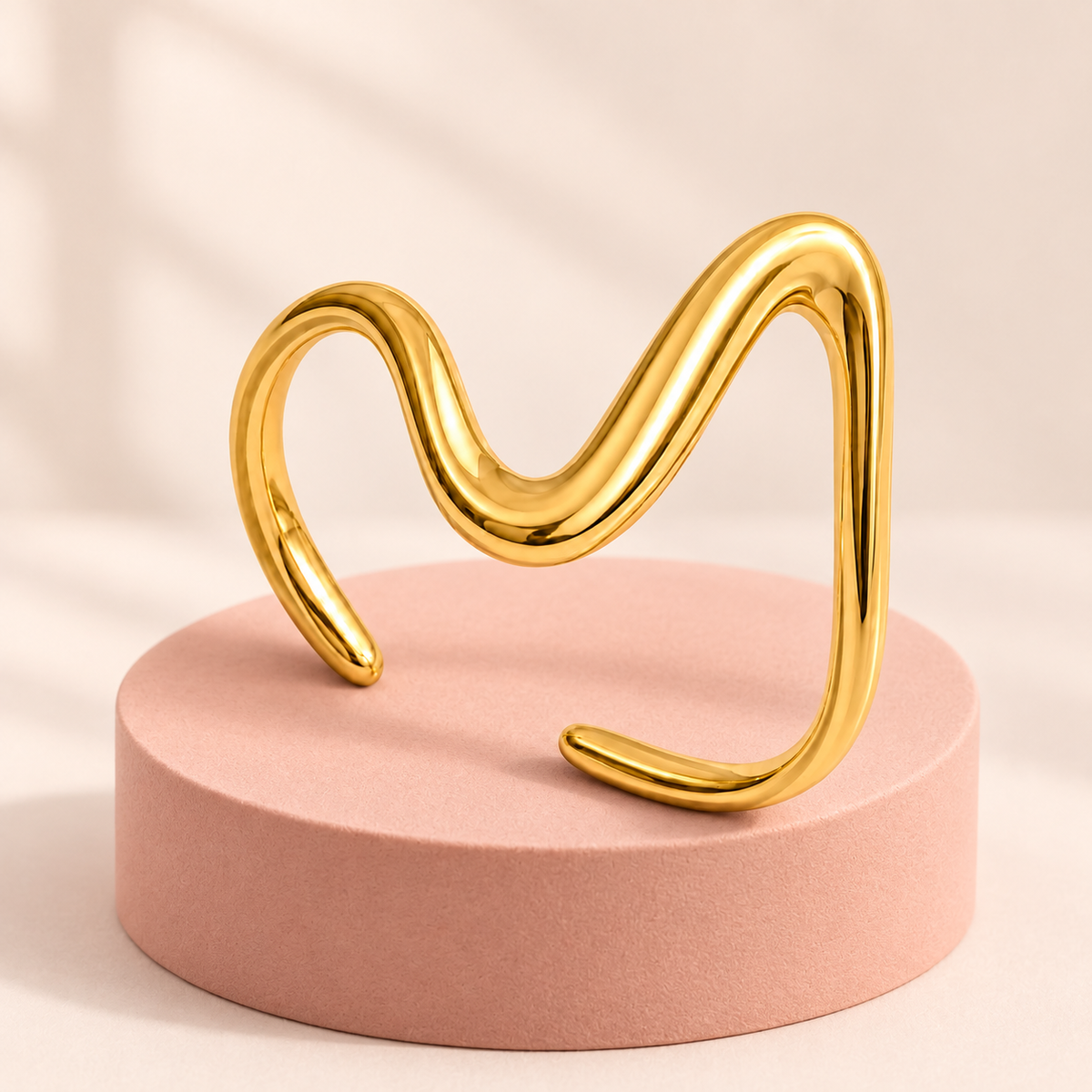 Gold-tone asymmetric wave ring, detail view.
