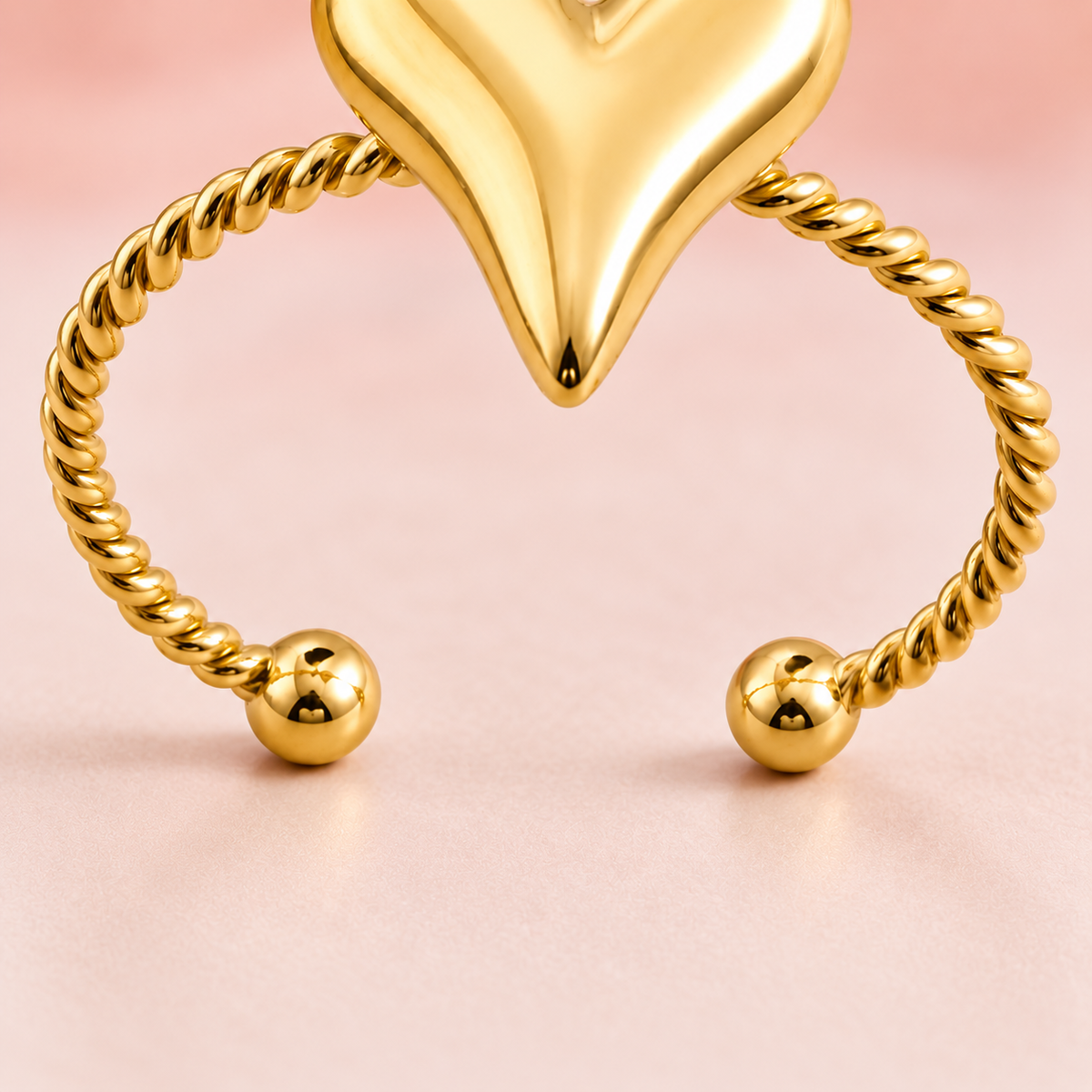 Gold-tone heart and rope ring, detail view.