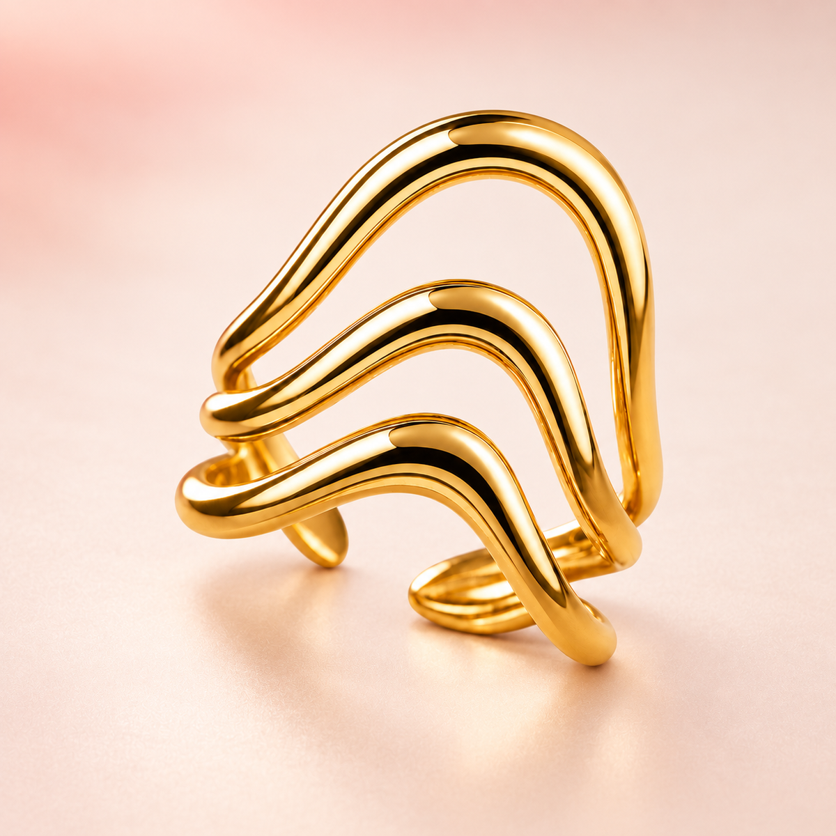 Gold-tone triple wave ring, product view.