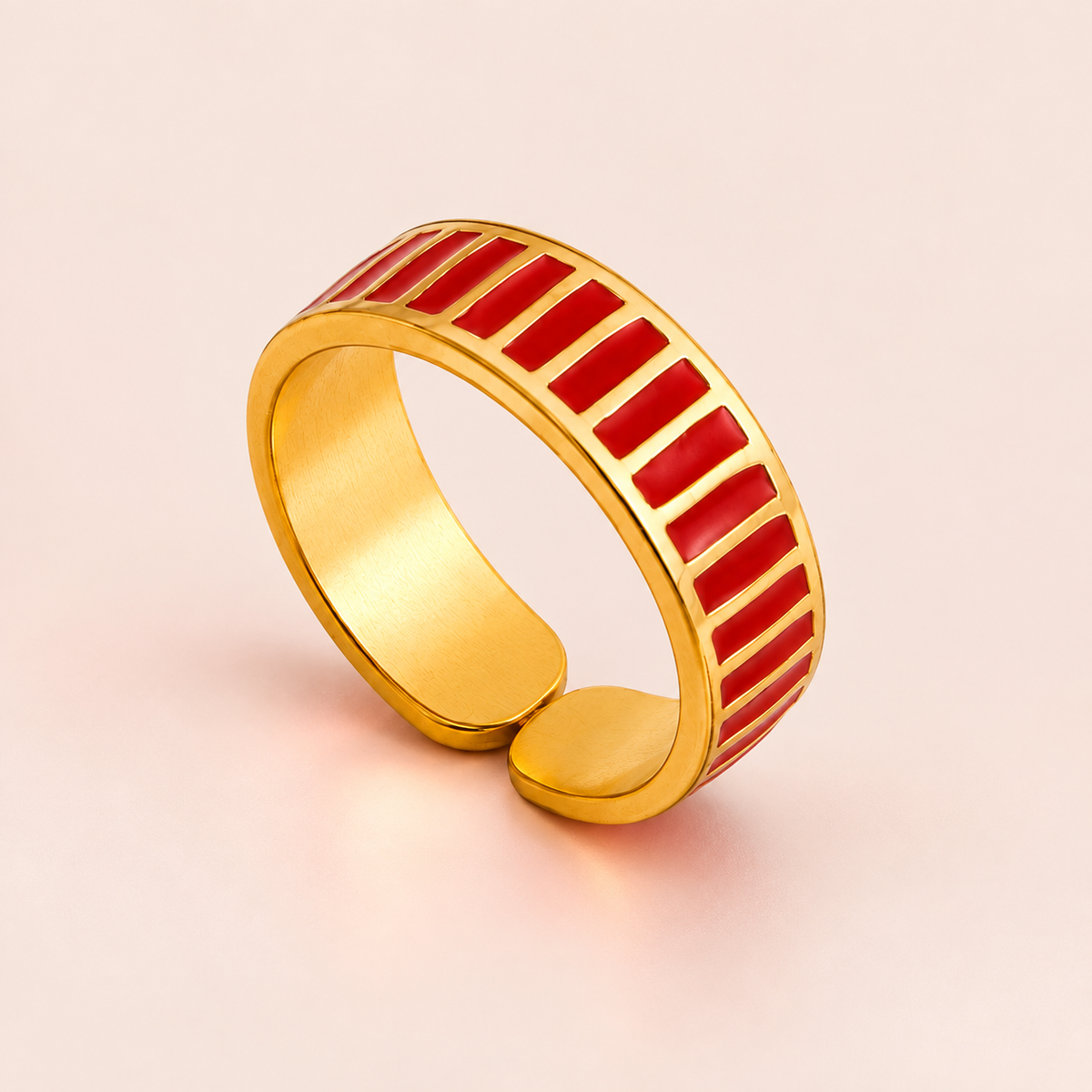 Gold-tone ring with red stripes, product view.