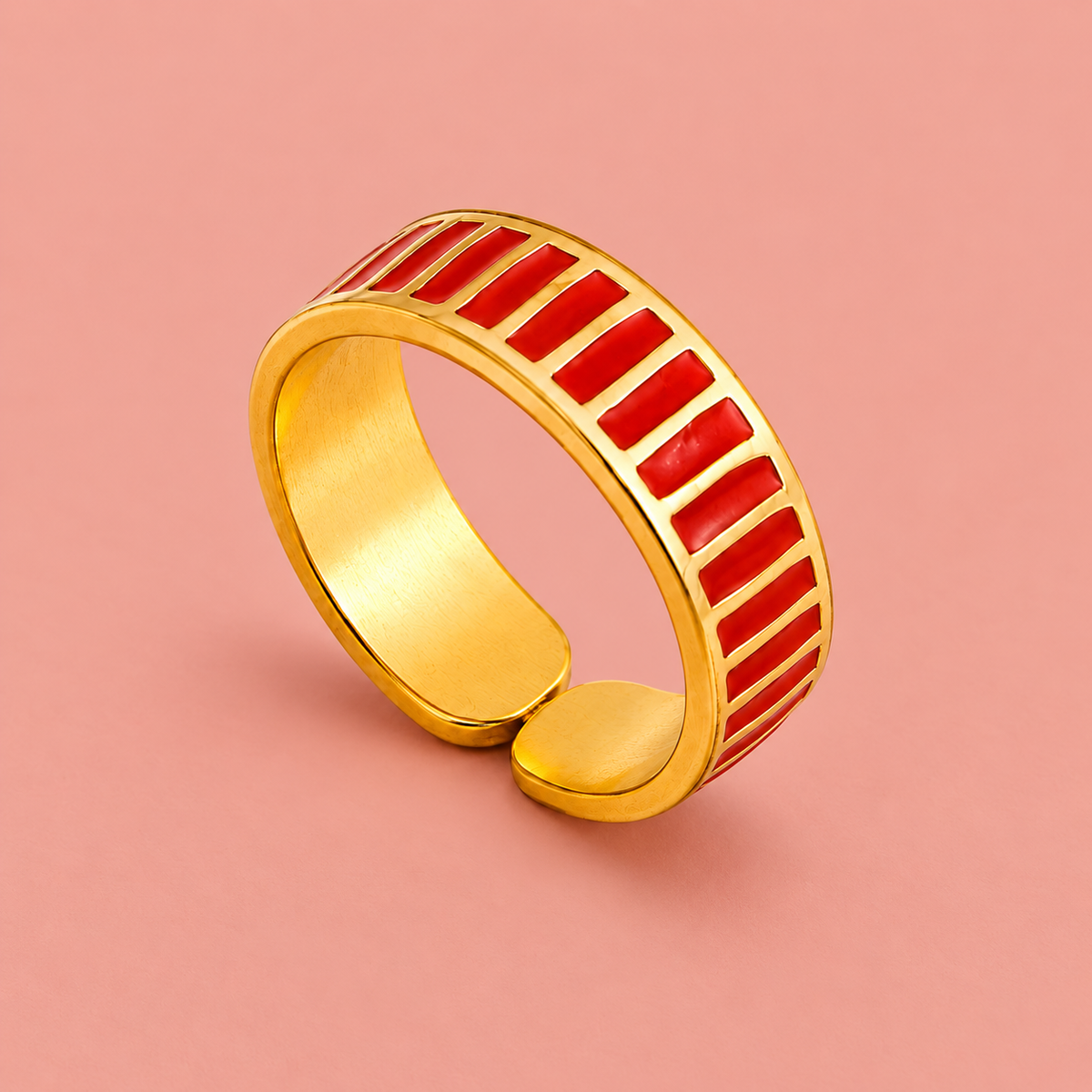 Gold-tone ring with red stripes, detail view.