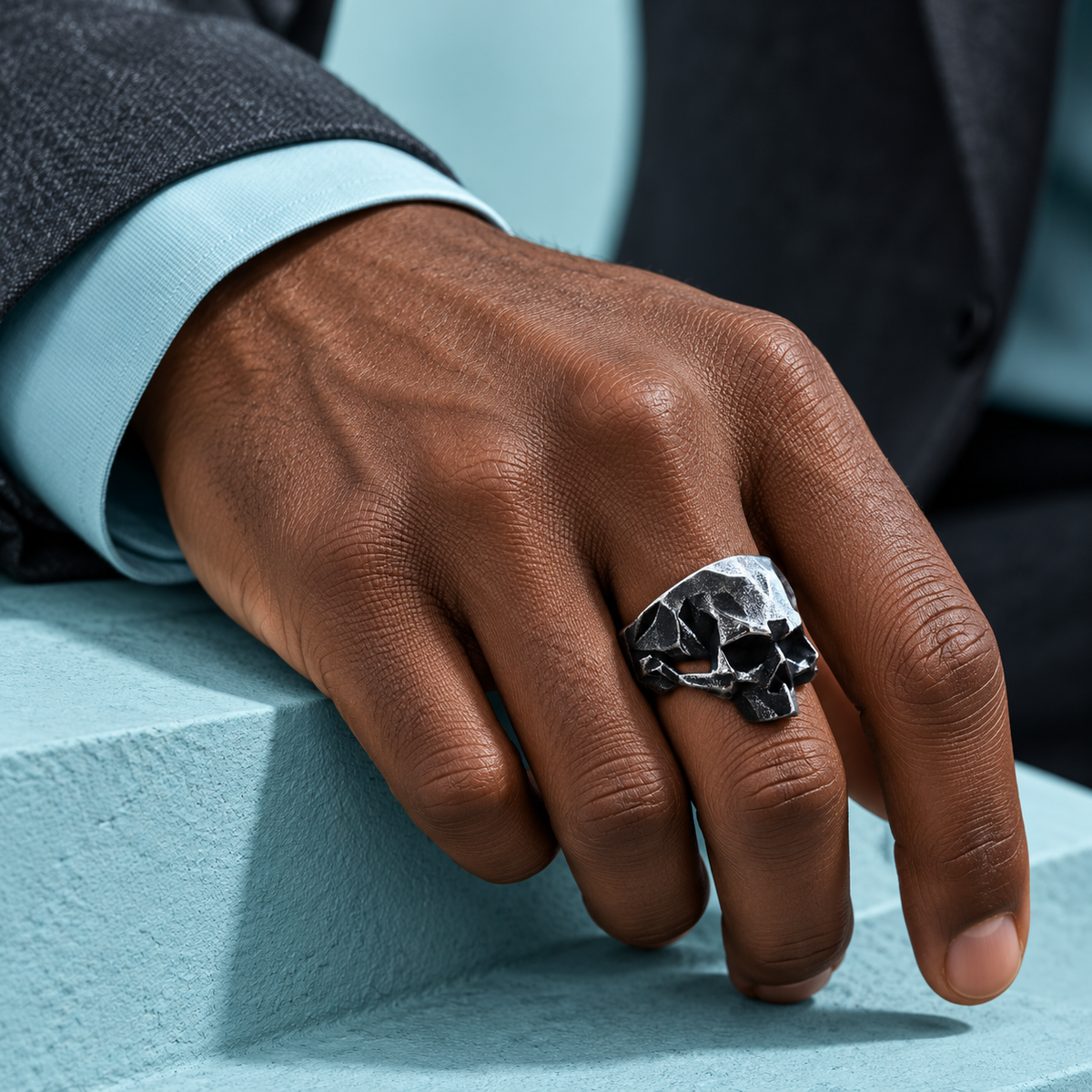 Angular Skull Ring shown on a hand.