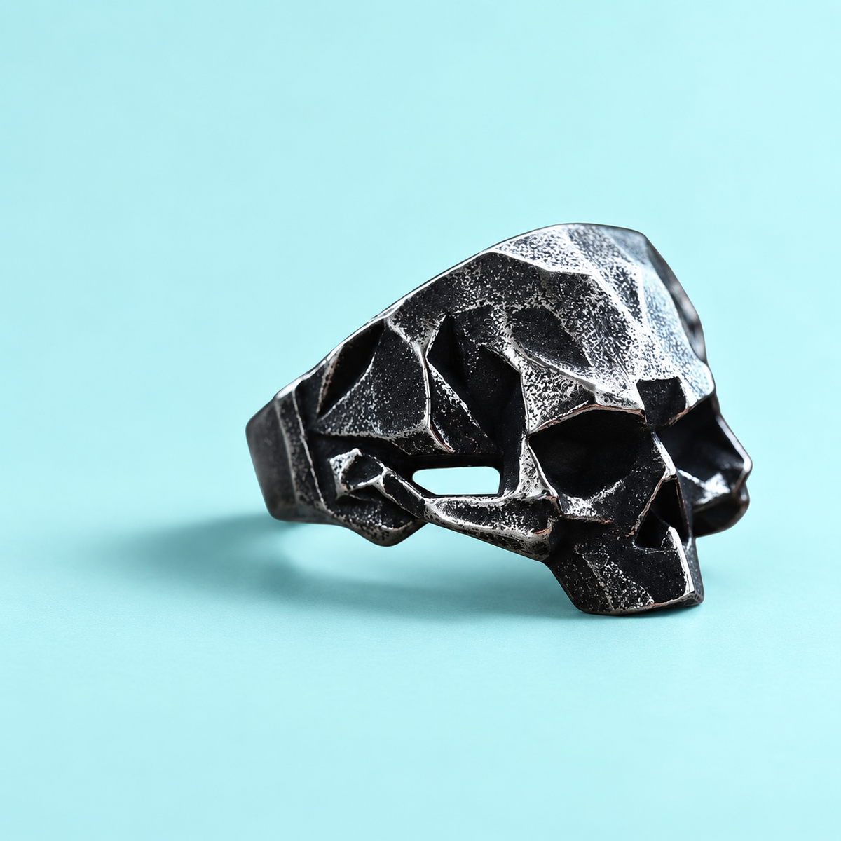 Angular Skull Ring in a styled product view.