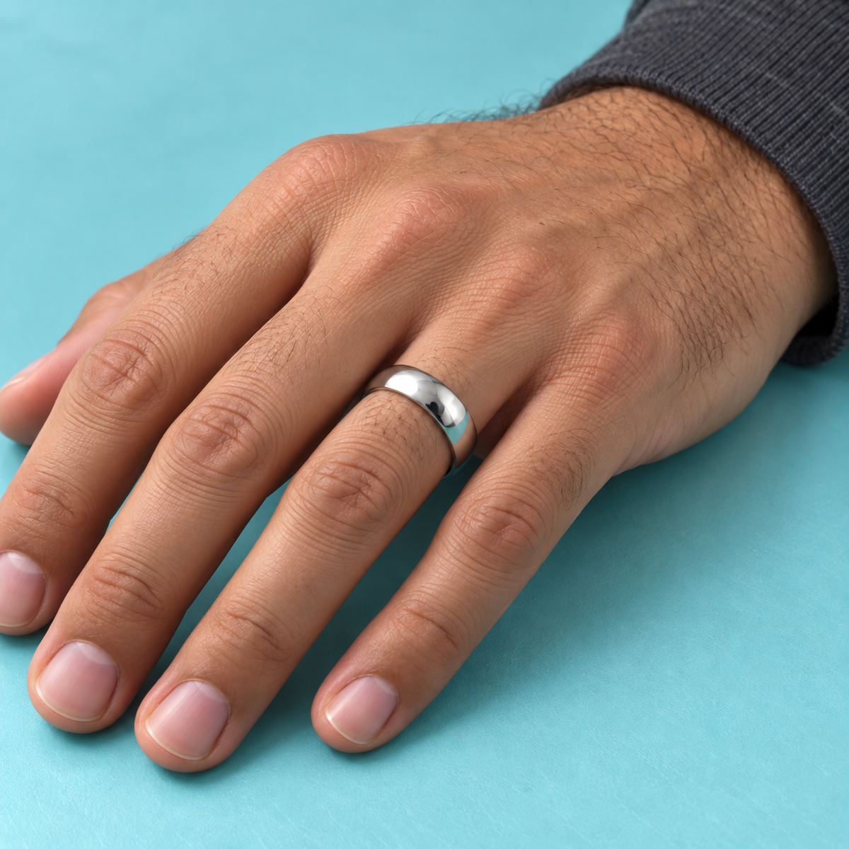 Smooth Silver-Tone Band shown on a hand.