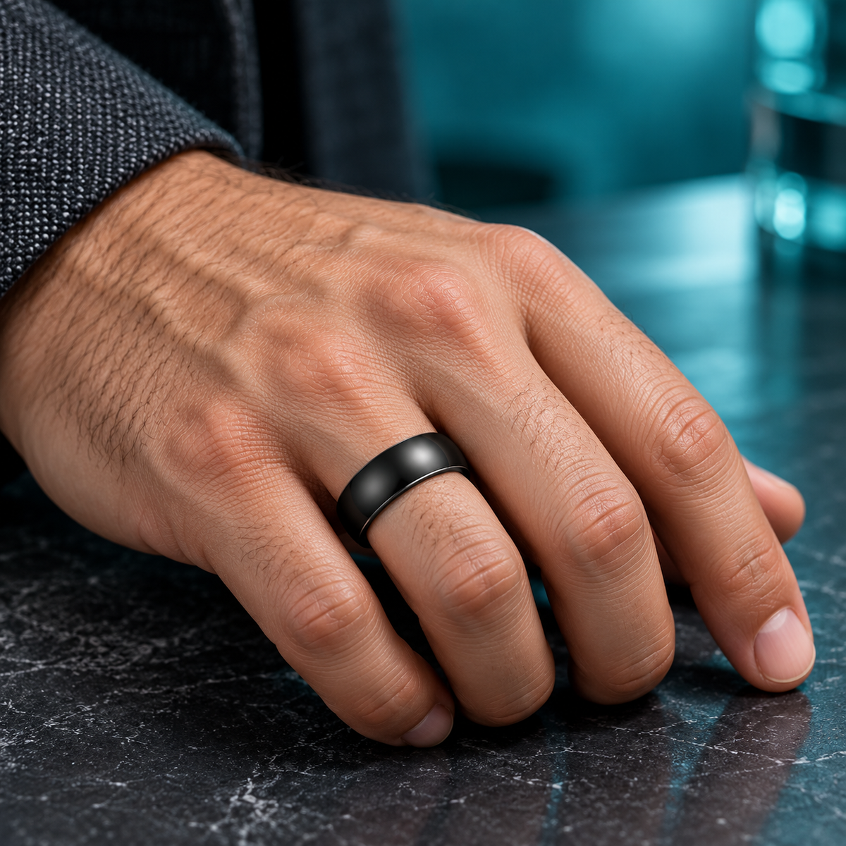 Black Domed Band Ring for Men shown on a hand.