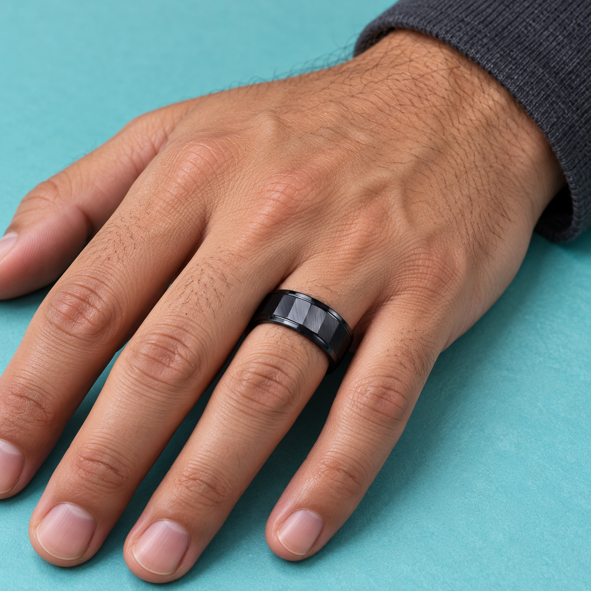 Black Faceted Panel Band shown on a hand.