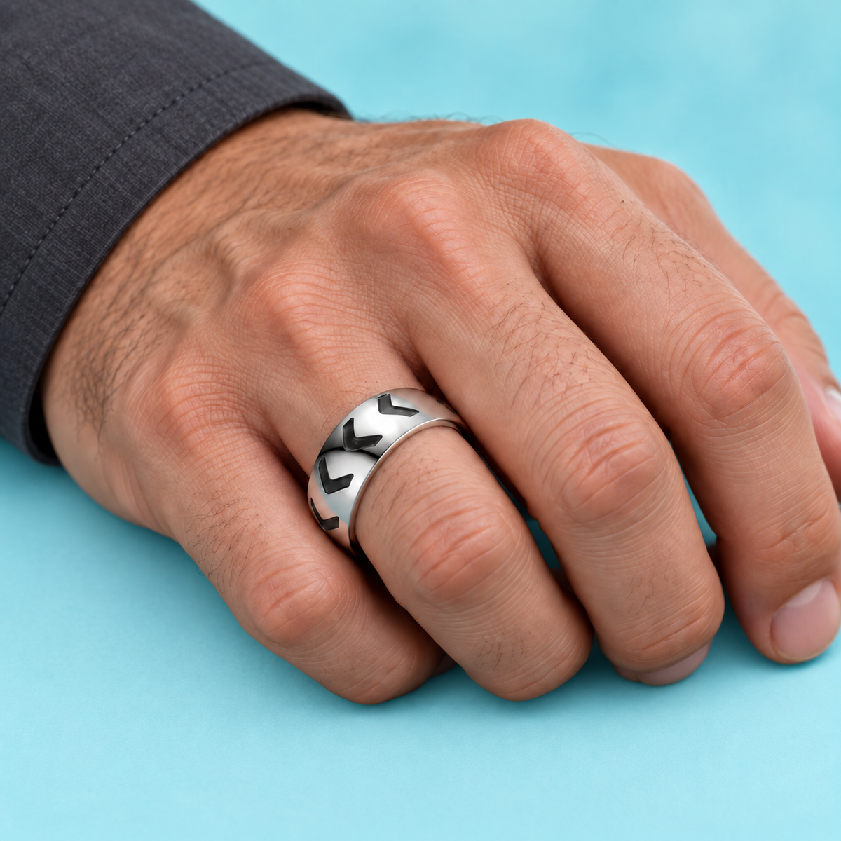 Silver-Tone Chevron Pattern Band shown on a hand.